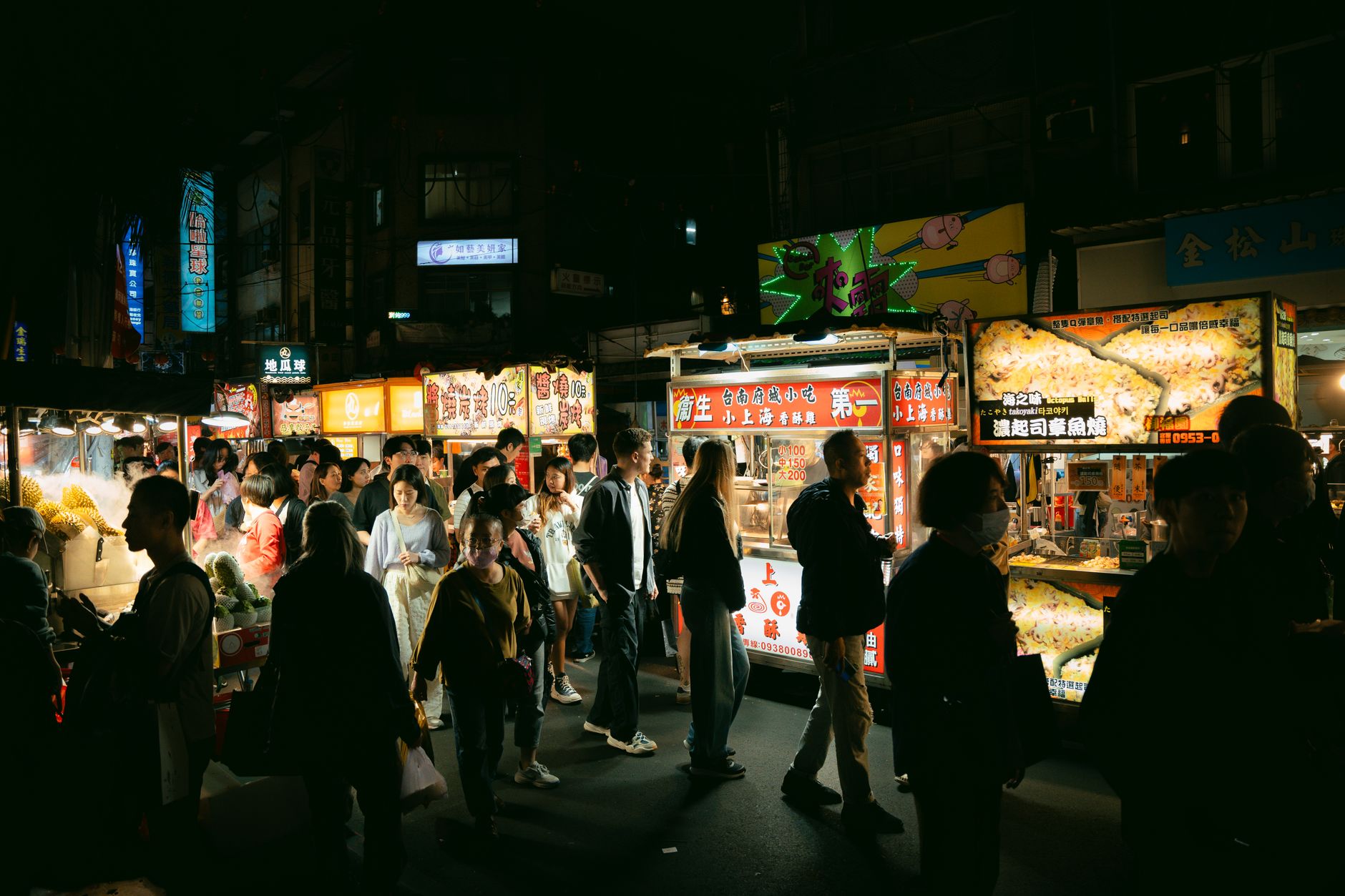 Night bazaar crowd under festival lights